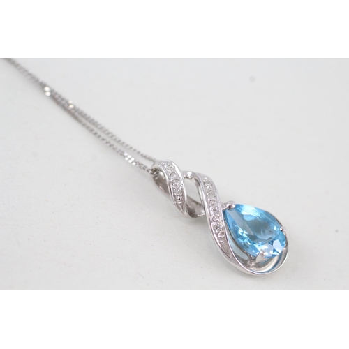 270 - 9ct gold blue topaz & diamond pendant necklace 2.4g