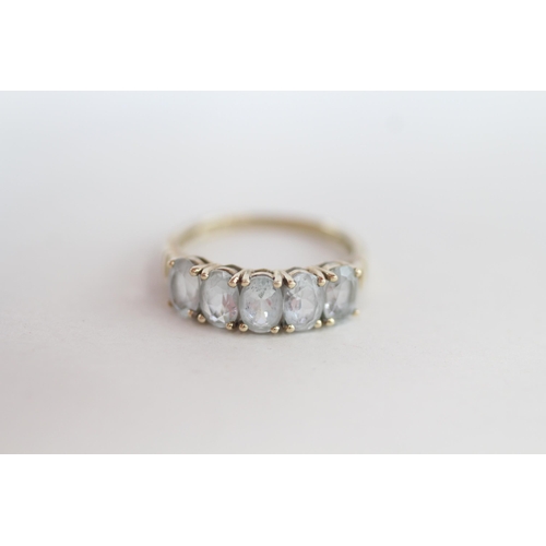 274 - 9ct gold oval cut aquamarine half eternity ring 2.6g Size Q