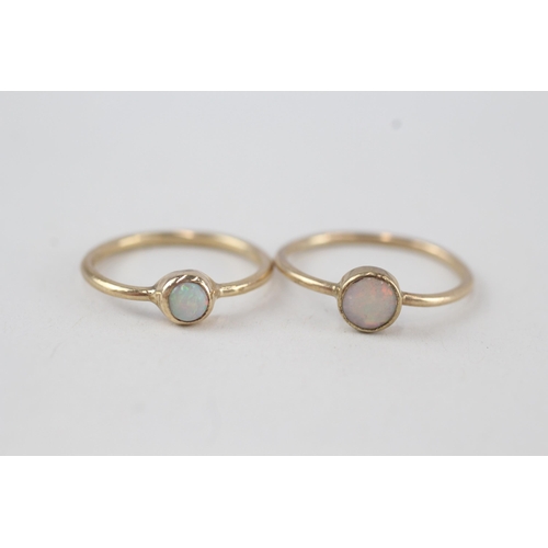 315 - 2x 9ct gold opal solitaire rings, bezel set 2.2g Size N & K