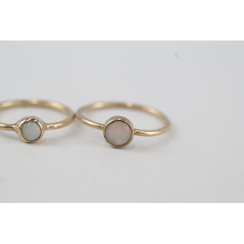 315 - 2x 9ct gold opal solitaire rings, bezel set 2.2g Size N & K