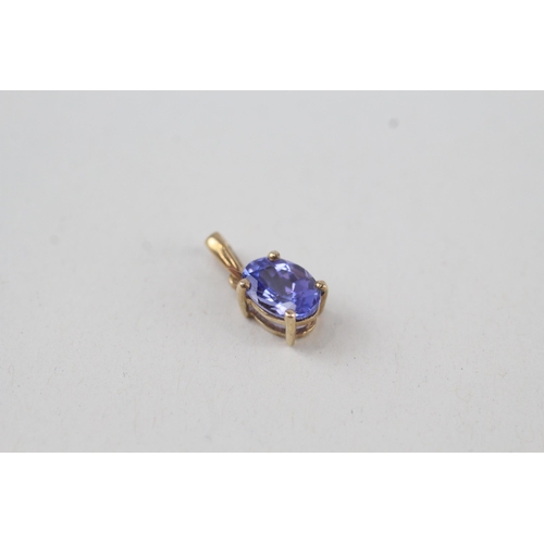 316 - 2x 9ct gold oval cut tanzanite pendant, claw set 1.2g