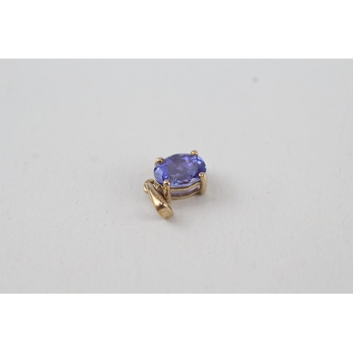 316 - 2x 9ct gold oval cut tanzanite pendant, claw set 1.2g