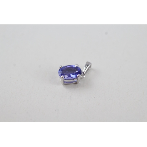 317 - 2x 9ct gold oval cut tanzanite pendant, claw set 1.1g