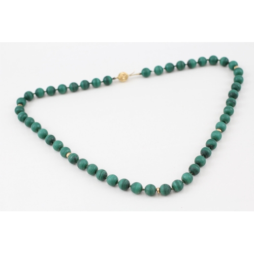 318 - 14ct gold malachite necklace individually knotted 54.7g