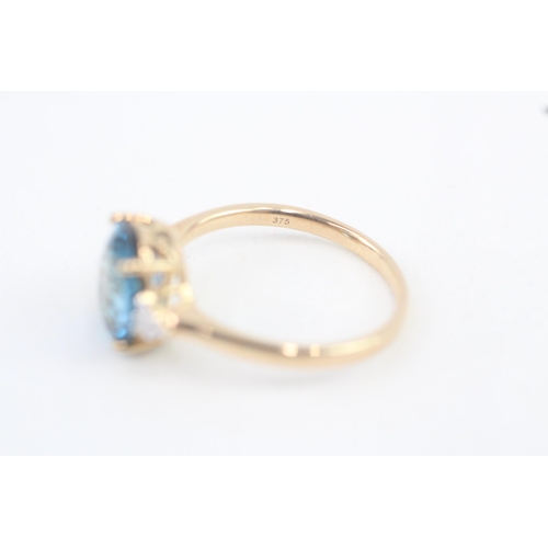 321 - 9ct gold blue topaz and diamond cocktail ring 3.7g Size S 1/2