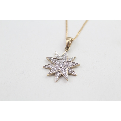 65 - 9ct gold cubic zirconia starburst pendant necklace 2.7g