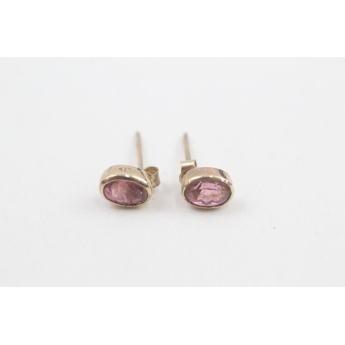 83 - 9ct gold oval pink tourmaline single stone stud earrings 1.1g