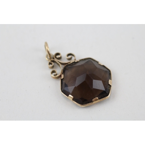 148 - 9ct gold smokey quartz pendant 3.1g