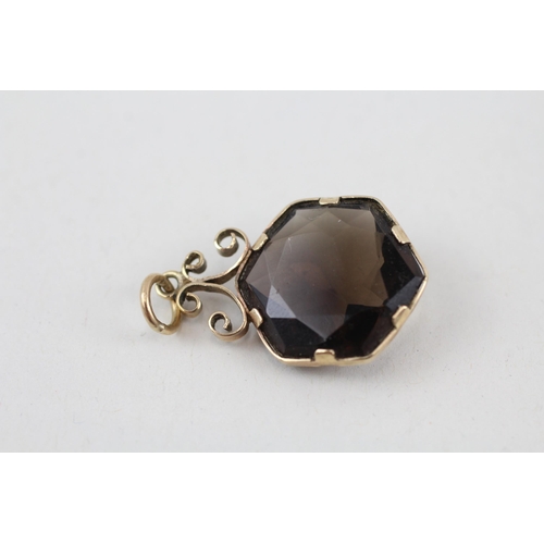 148 - 9ct gold smokey quartz pendant 3.1g