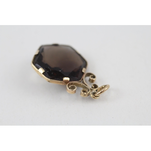 148 - 9ct gold smokey quartz pendant 3.1g