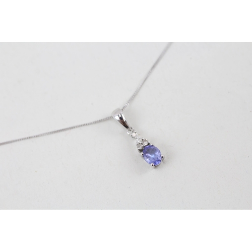 15 - 9ct white gold tanzanite and diamond pendant with 9ct white gold chain 1.1g