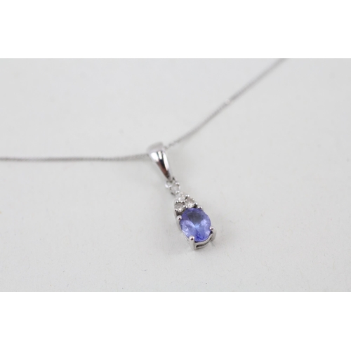 15 - 9ct white gold tanzanite and diamond pendant with 9ct white gold chain 1.1g