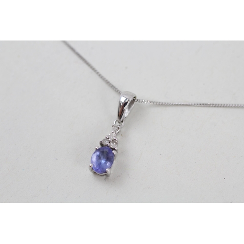 15 - 9ct white gold tanzanite and diamond pendant with 9ct white gold chain 1.1g