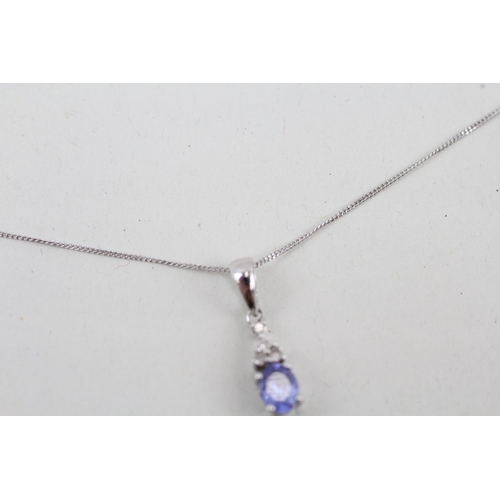 15 - 9ct white gold tanzanite and diamond pendant with 9ct white gold chain 1.1g