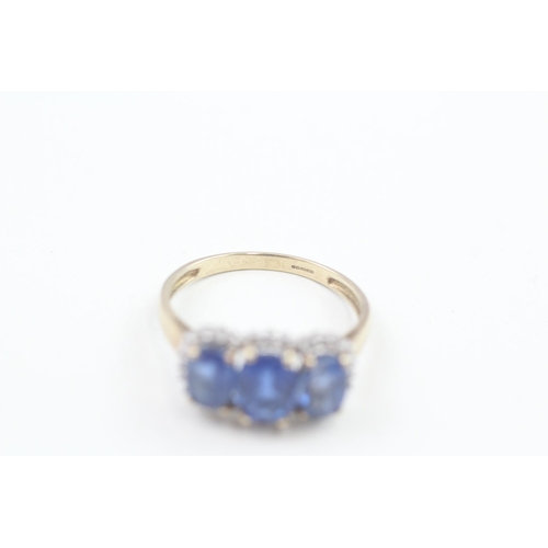 151 - 9ct gold kyanite and diamond halo trilogy cocktail ring 3.2g   Size P