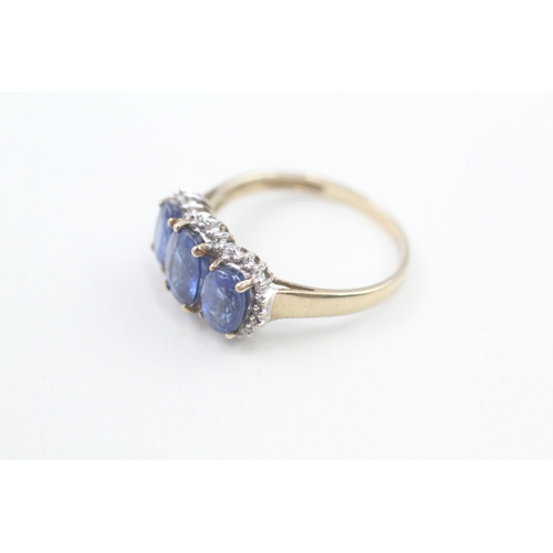 151 - 9ct gold kyanite and diamond halo trilogy cocktail ring 3.2g   Size P