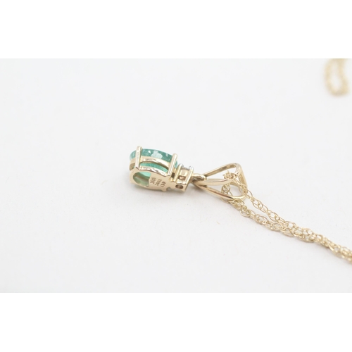 152 - 9ct gold emerald and white gemstone pendant with 9ct gold chain 1.5g