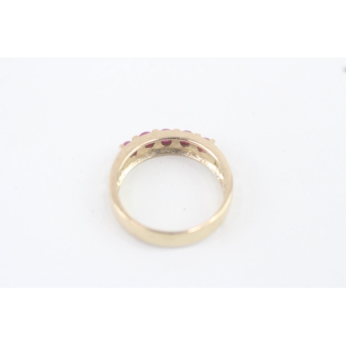 155 - 9ct gold ruby half eternity ring with cut work shoulders 2.9g   Size N