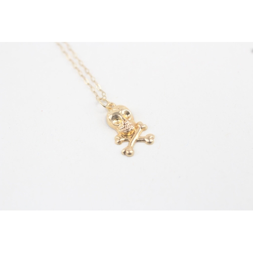 30 - 9ct gold skull and crossbones pendant with 9ct gold chain 0.6g