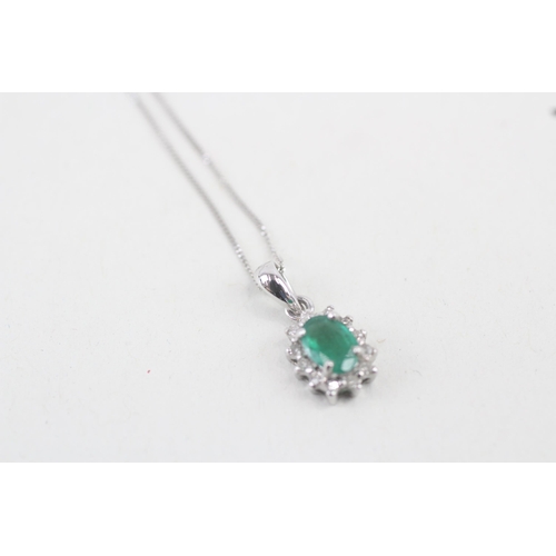 41 - 9ct white gold emerald and diamond halo pendant with 9ct white gold chain 1.3g