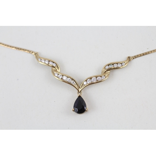 56 - 9ct gold sapphire and cubic zirconia pendant with 9ct gold chain 3.2g