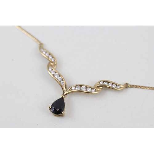 56 - 9ct gold sapphire and cubic zirconia pendant with 9ct gold chain 3.2g