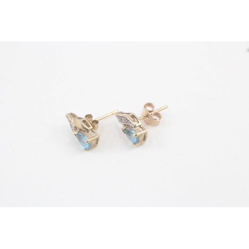 61 - 9ct gold blue topaz and diamond stud earrings 1.2g