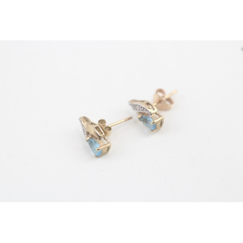 61 - 9ct gold blue topaz and diamond stud earrings 1.2g