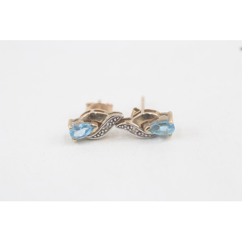 61 - 9ct gold blue topaz and diamond stud earrings 1.2g