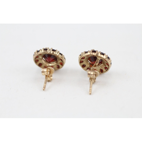 62 - 9ct gold vintage garnet halo stud earrings 2g