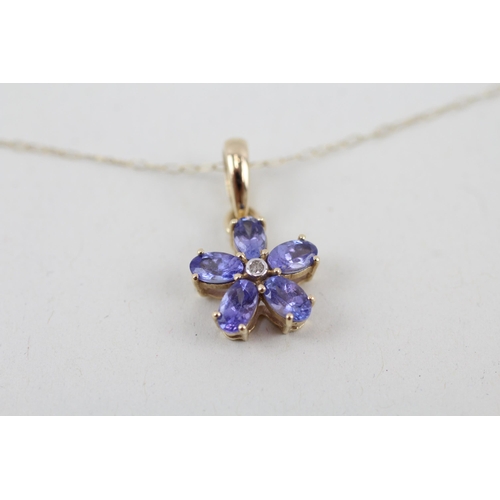 63 - 9ct gold tanzanite and diamond floral pendant with 9ct gold chain 1.8g