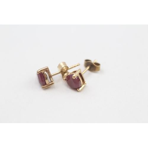 91 - 9ct gold ruby trillion cut solitaire stud earrings 1.4g