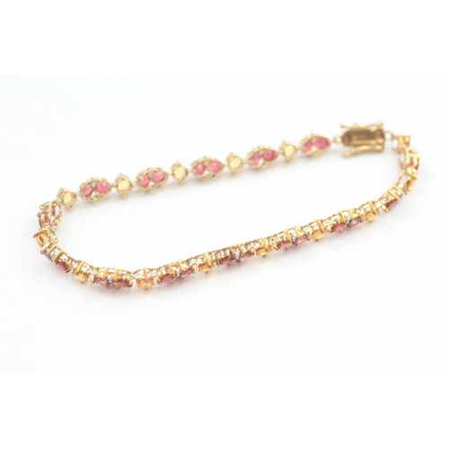 92 - 9ct gold diamond, red and yellow gemstone tennis bracelet 8.2g