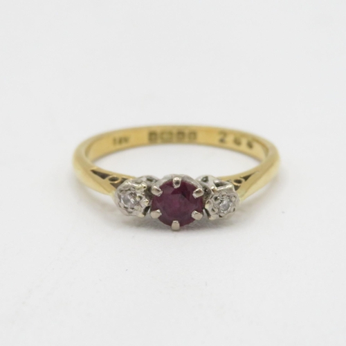 103 - 9ct gold diamond & ruby three stone ring 2.3g Size N