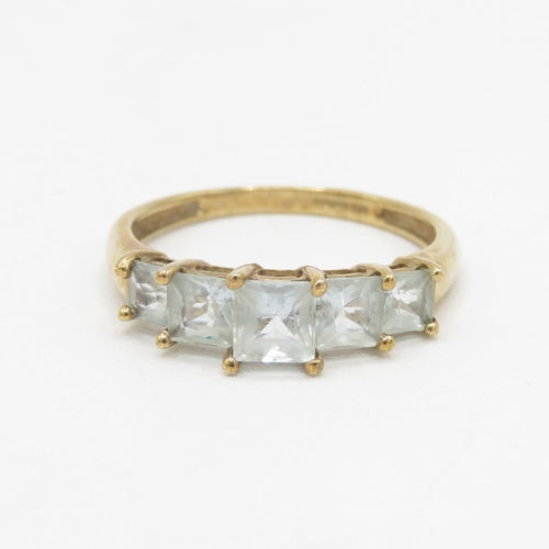 135 - 9ct gold aquamarine five stone ring 2.2g Size R