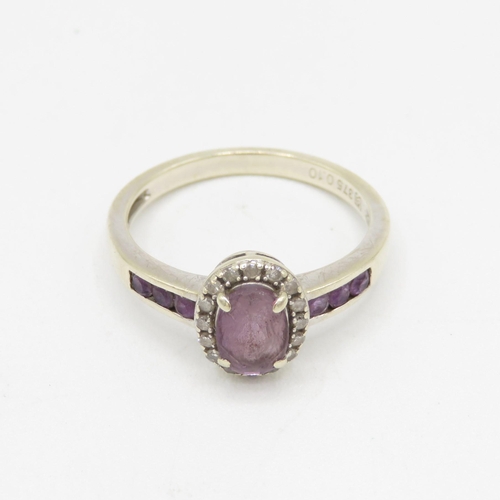 148 - 9ct gold diamond & amethyst oval halo ring with amethyst set shoulders 2.5g Size O