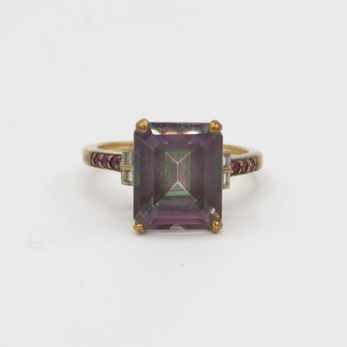 54 - 9ct gold mystic topaz single stone ring with diamond sides & ruby set shoulders 3.4g Size N