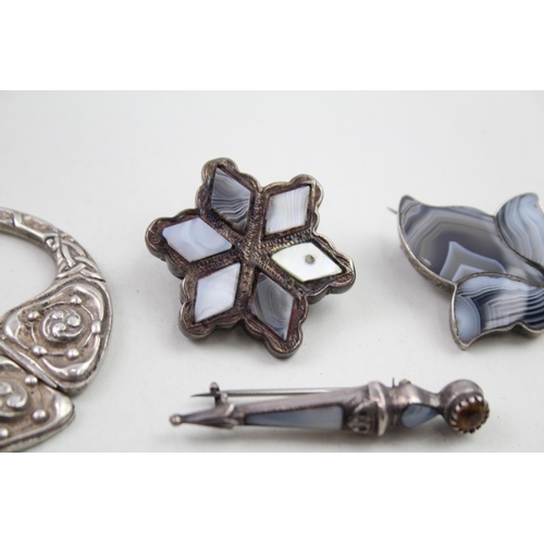 303 - Four silver Scottish brooches including Agate (34g)