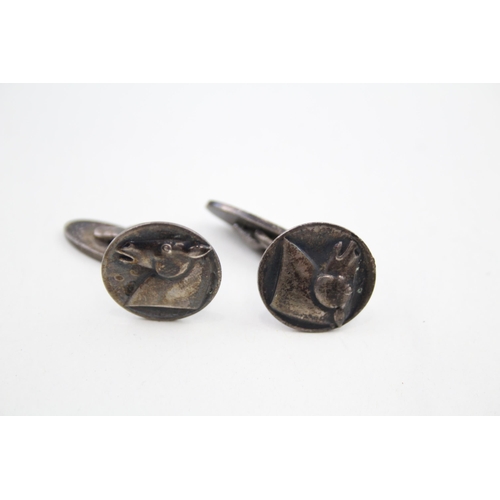 307 - Pair of silver cufflinks with horse head design by Georg Jensen (13g)