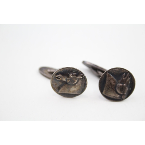 307 - Pair of silver cufflinks with horse head design by Georg Jensen (13g)