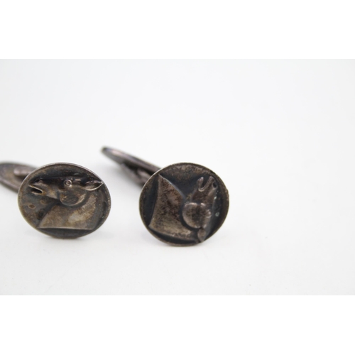 307 - Pair of silver cufflinks with horse head design by Georg Jensen (13g)