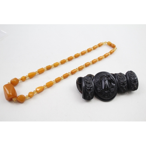 318 - Antique carved jet bracelet and Bakelite necklace (49g)