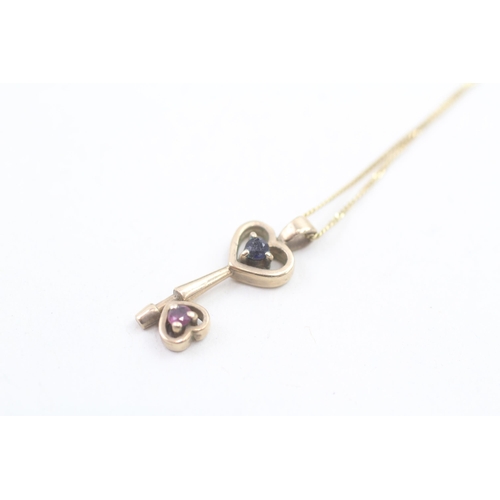 108 - 9ct gold diamond & ruby openwork key pendant necklace (1.8g) Size L