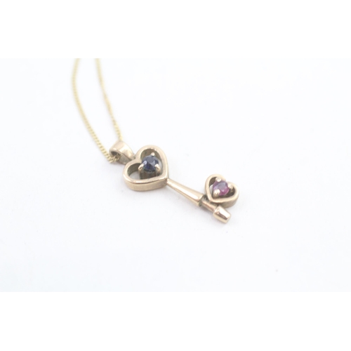 108 - 9ct gold diamond & ruby openwork key pendant necklace (1.8g) Size L