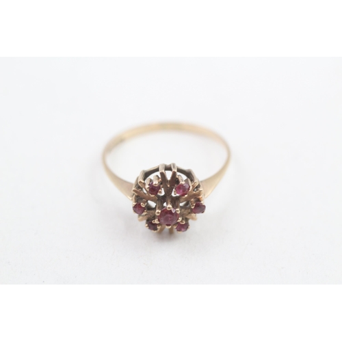 120 - 9ct gold ruby seven stone floral cluster ring (1.6g) Size P 1/2