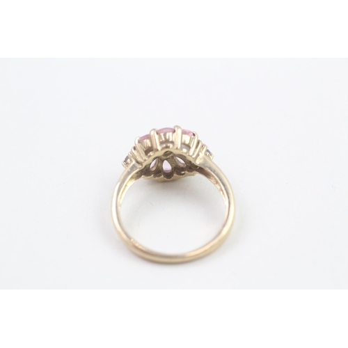126 - 9ct gold pink sapphire and iolite set cluster ring (3.5g) Size N