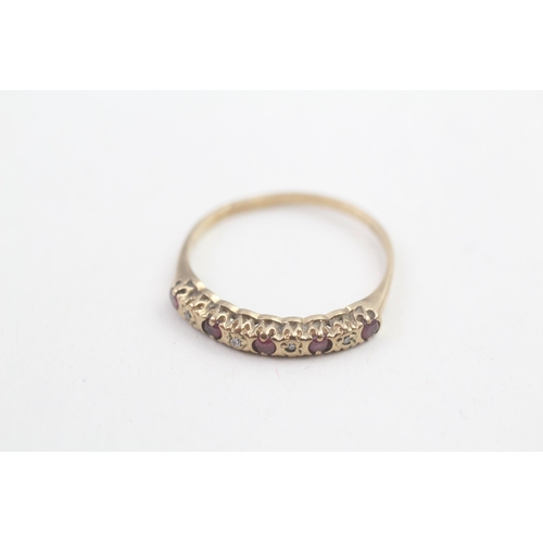 128 - 9ct gold ruby and diamond set nine stone eternity ring (1.3g) Size O 1/2