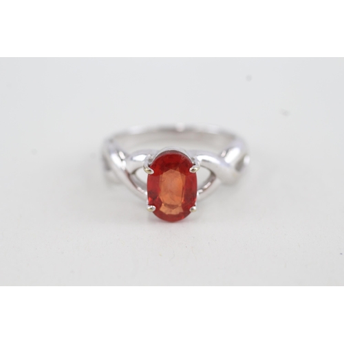 131 - 9ct white gold orange sapphire single stone ring with openwork shank (4.1g) Size O