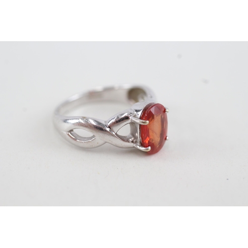 131 - 9ct white gold orange sapphire single stone ring with openwork shank (4.1g) Size O