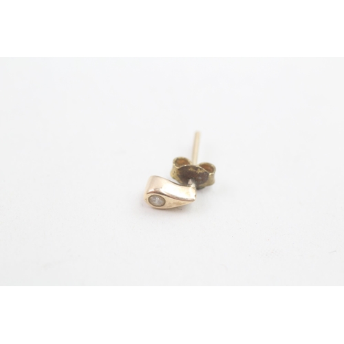 142 - 9ct gold diamond set teardrop stud earrings (1.2g)